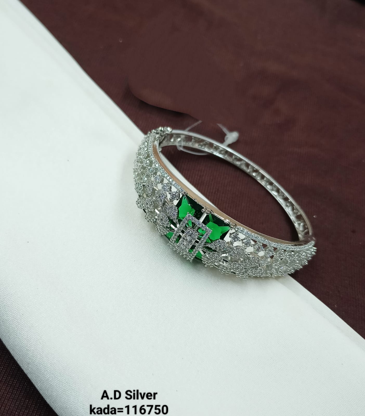 Elegant A.D. Silver Bracelet with Emerald Green Accent